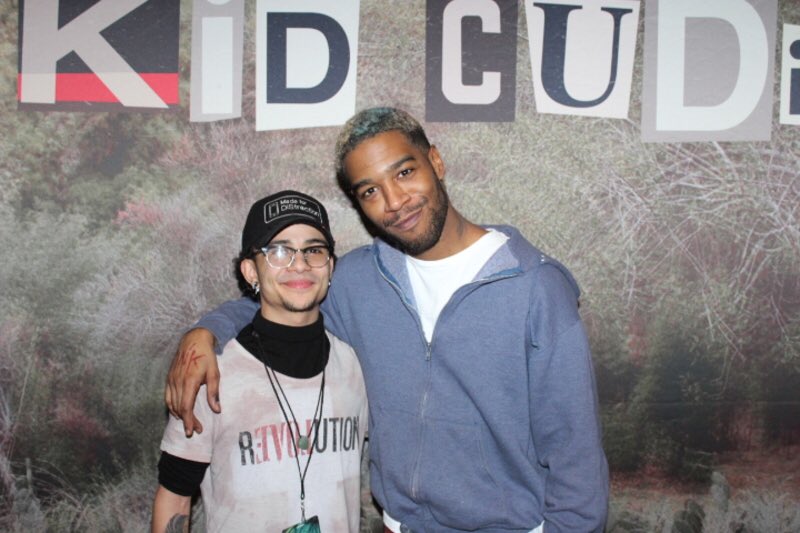 E_gotrip's tweet image. Standing next to @KidCudi with a "Revolution/ Love shirt"...and a @DiStractionApp hat! The messages are everywhere