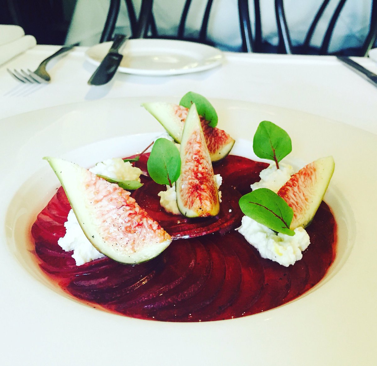 Blood plumbs with figs straight from Fiona Bacash's garden, sweetened ricotta and red sorrel