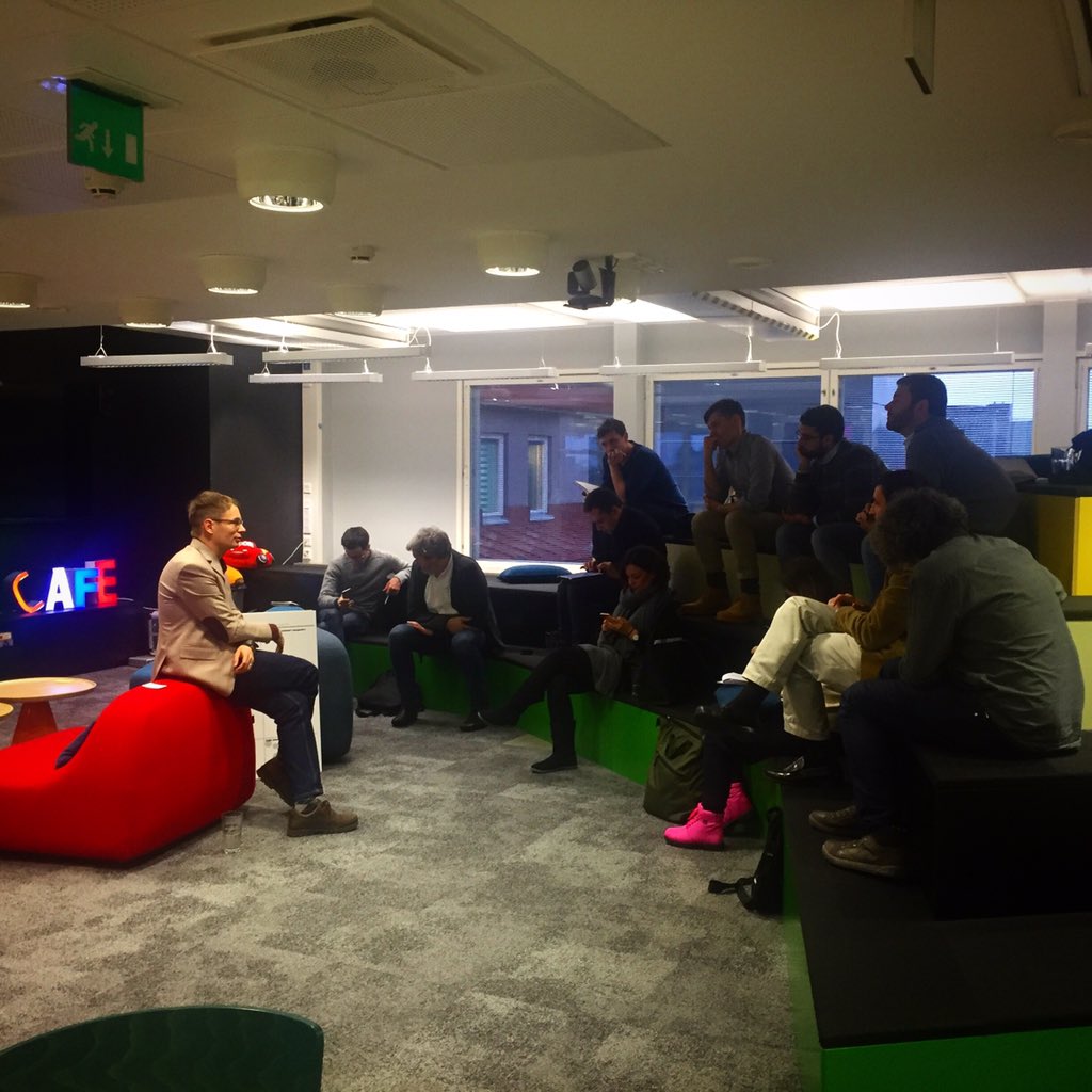 .<a href="/TuomasSyrjanen/">Tuomas Syrjänen</a> talks about #workingatfuturice with some visitors from #Spain.