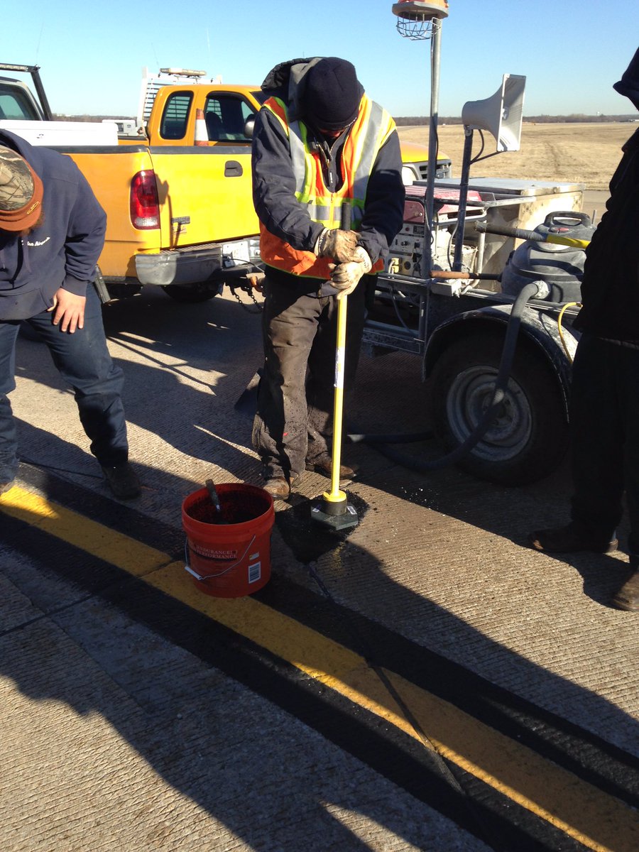 Aquaphalt's tweet photo. The #Aquaphalt team hard at work @tulsaairports #permanentrepair #pothole https://t.co/PxT5AkgcWh