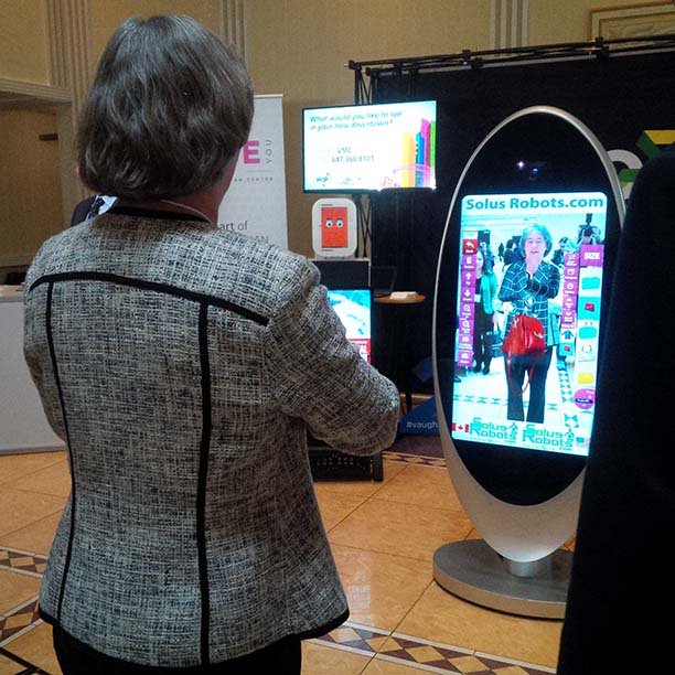 FedDevOntario's tweet photo. @_DebSchulte tries @solusrobots virtual dressing room at the #VBX16 #SME #Vaughan https://t.co/XdgQmxuGNJ
