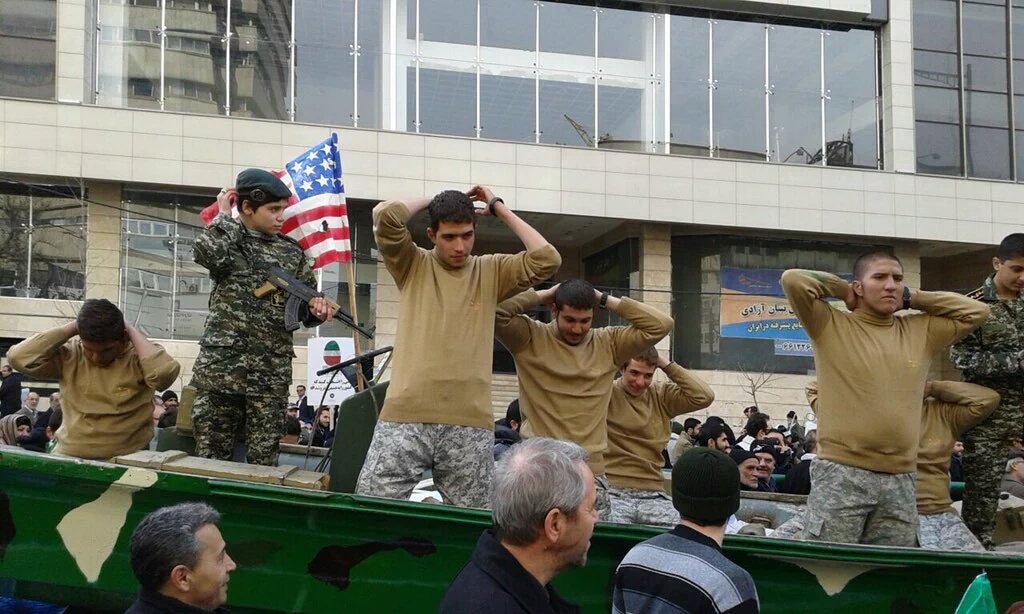 SattarSaeedi's tweet image. #Iran'ian demonstrators reenact #USMarines' capture, during the Islamic Revolution anniversary parade in Tehran.