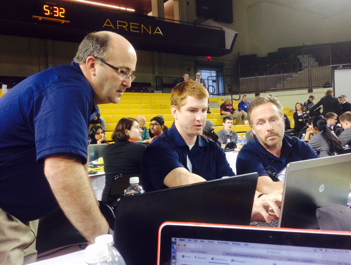 cmuerpsim's tweet photo. SAF Holland mentors helping Darin before round three. #cmuERPsim2016 https://t.co/hIp8nuSYqW