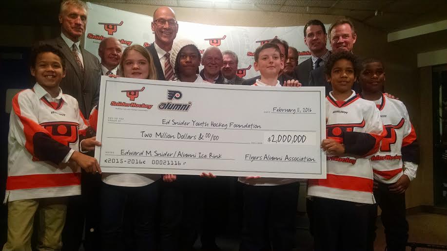 The <a href="/FlyersAlumni/">Flyers Alumni</a> present $2M check to <a href="/SniderHockey/">Ed Snider Youth Hockey & Education</a> for building new rink: our personal "thank you" to Mr. Snider.