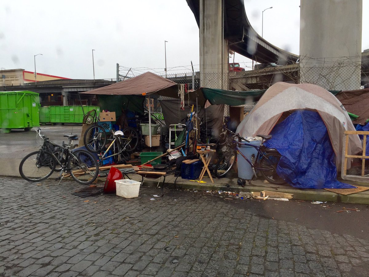 Lots more bikes/trash at full tent camp on SE Alder and Water Ave. cc: <a href="/BikePortland/">BikePortland</a> <a href="/PPBBikeTheft/">PPB BTTF</a> @MayorPDX