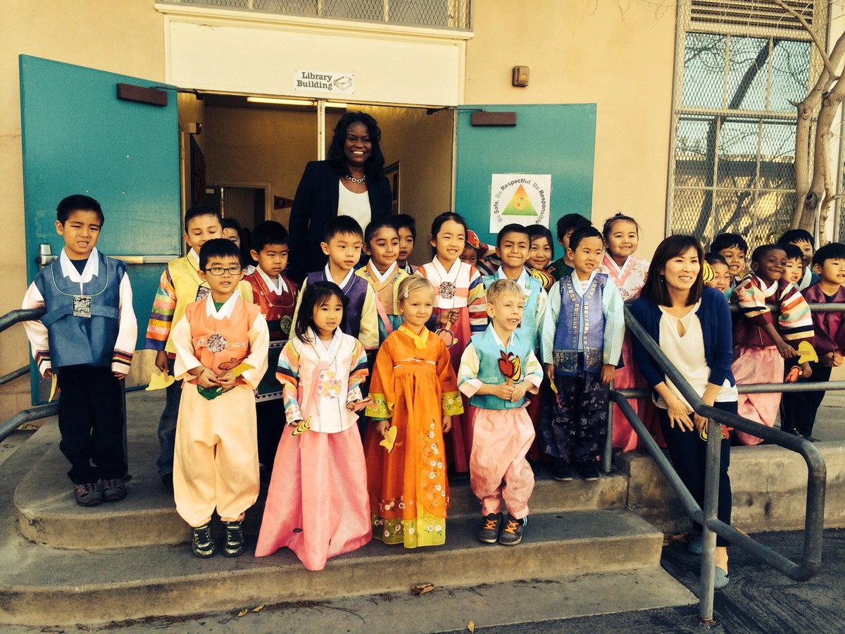 LASchools's tweet photo. Costumed kindergartners in the Korean dual-language program at Denker ES greet Supt. Michelle King. https://t.co/K1Nnjg8KAE