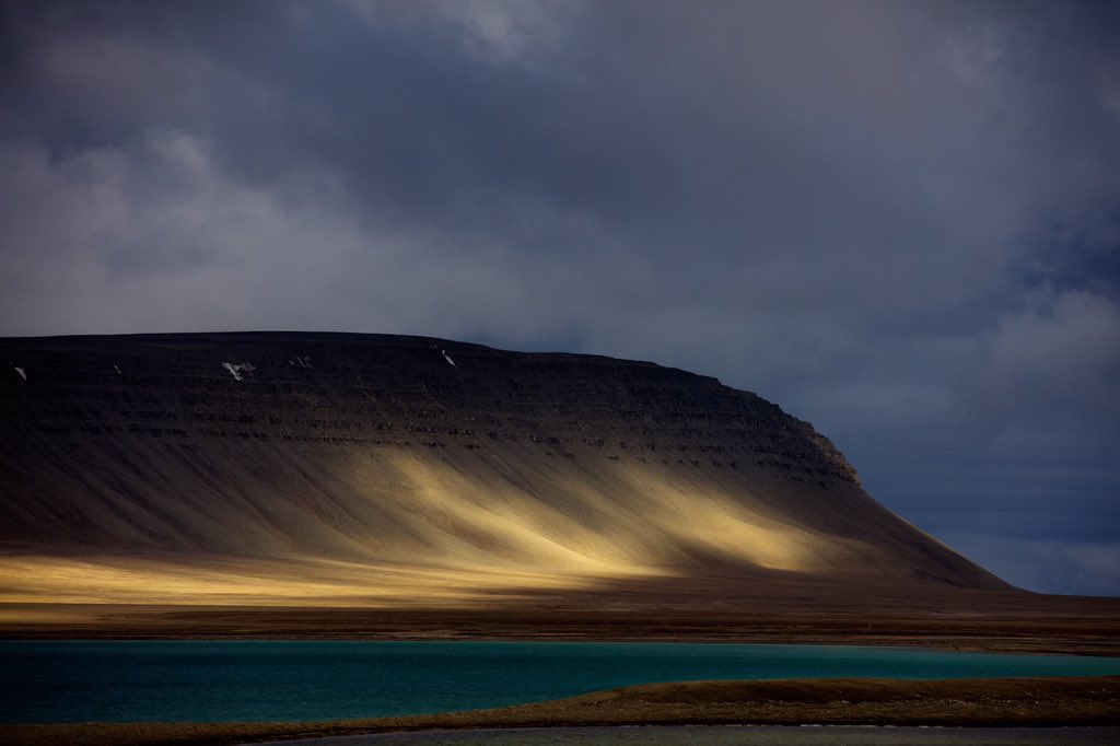 AdventureCanada's tweet photo. Light plays on the shore of Beechey Island, NU. Photo by Jason Van Bruggen #arctic #adventure #franklin https://t.co/9rCzULDaAp