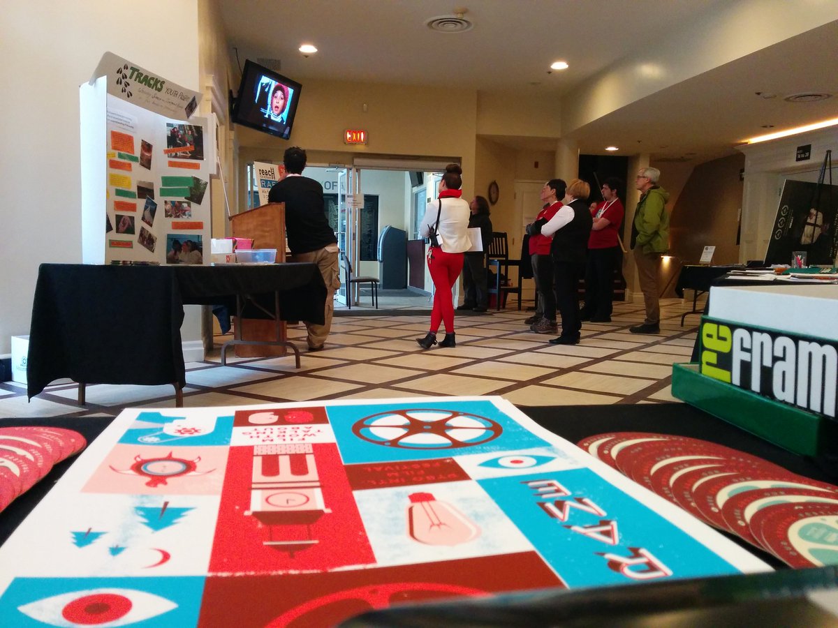 ejmidzin's tweet image. Even volunteers in the lobby are watching films at #ReFrame2016