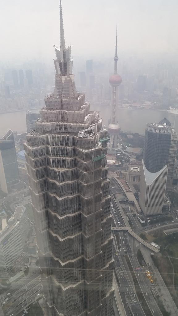 GabeFin's tweet photo. Meeting folks at the #WorldFinancial Center in #Shanghai -Looking down on the Jin Miao Tower Impressive #SkyLounge https://t.co/xRHvPqNDJH