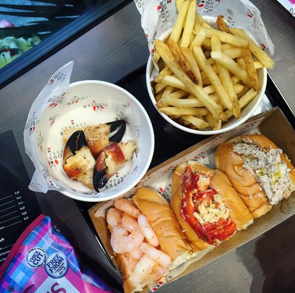 Shrimp, lobster &amp; crab rolls with a side of crab claws &amp; truffle fries at the newly opened Lobster central #foodporn