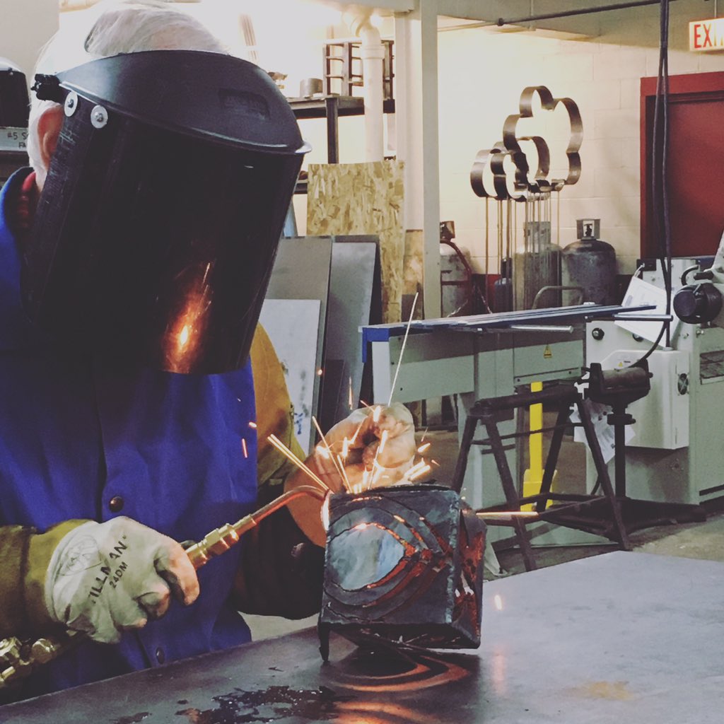 holdensc's tweet photo. Pete turning his cube into a lotus blossom candle holder #ciadc #steel #fabrication #chicago #welding @ChicagoIADC https://t.co/bjTsT2eMwf