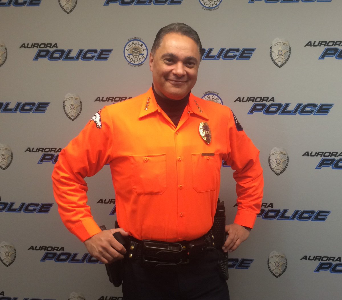 AuroraPD's tweet photo. Hey @SeattlePD we converted Chief Metz from a @Seahawks fan to a @Broncos fan! #UnitedInOrange #SB50 https://t.co/ndVQAeThKR