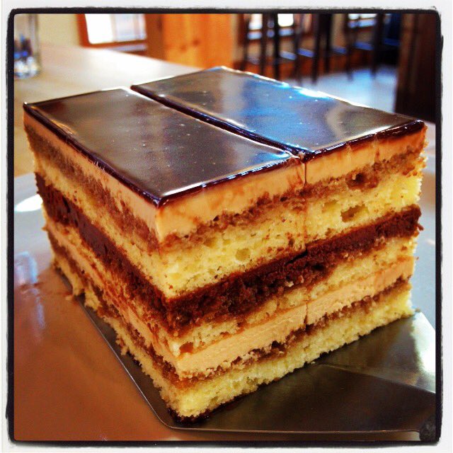 L'Opera Cake on new dessert menu. Almond sponge cake soaked in ESB coffee, coffee buttercream, ganache.