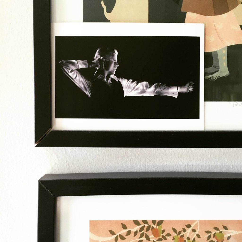 caitlinkuhwald's tweet photo. Thin White Duke looking over me these days in the studio. Tucked in frame of a #danielkrall print @DavidBowieReal https://t.co/g7iJ1DmjNQ