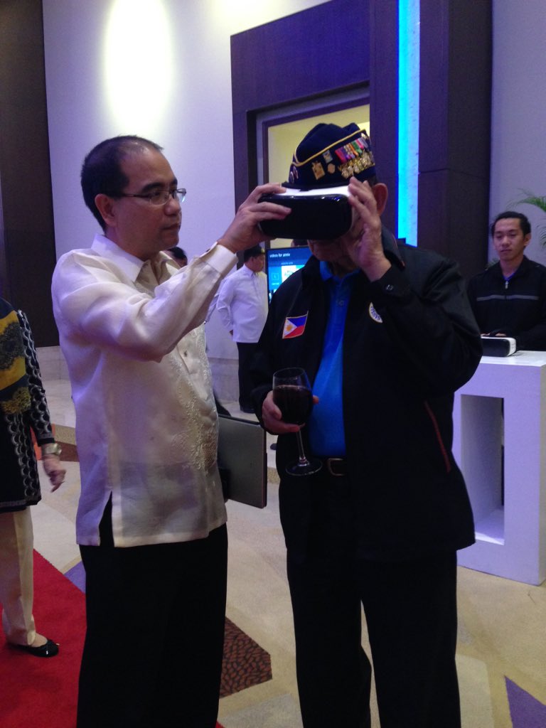 manilabulletin's tweet photo. F-VR: Former Pres Ramos checks out our Samsung Gear VR w/ TechNews editor @artsamaniego at the MB anniversary #MB116 https://t.co/cdj7M9Zrwv