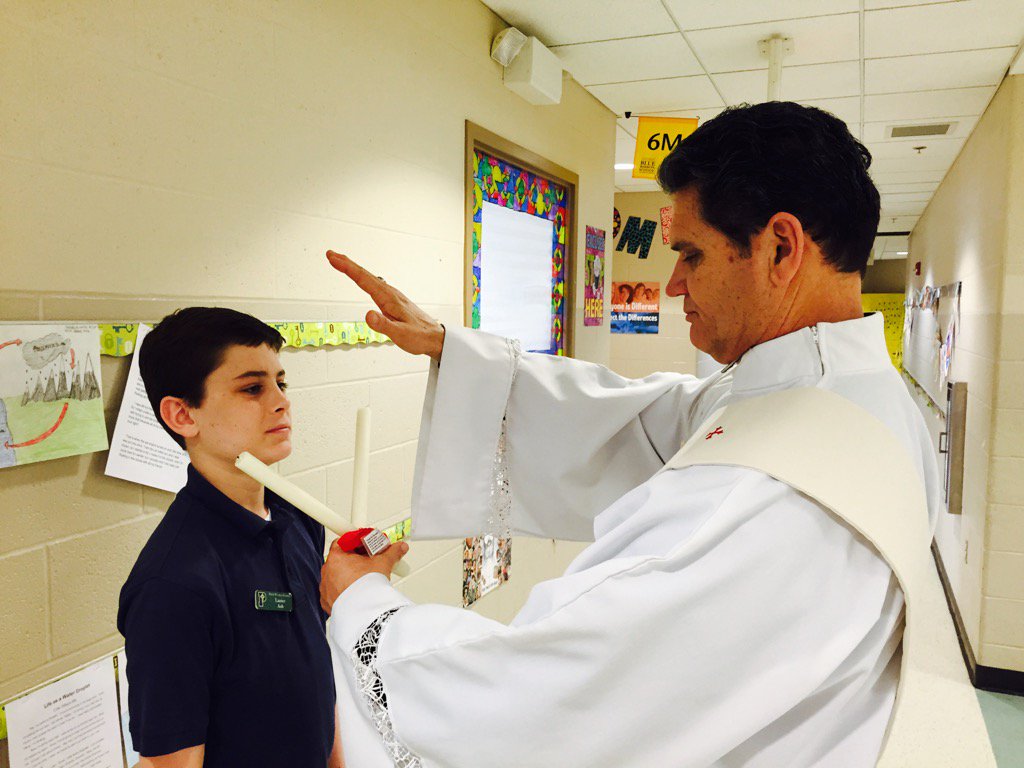 MrsLKelly_SMA's tweet photo. Deacon Greg administers a blessing of the throat https://t.co/nOyVHTP8f6