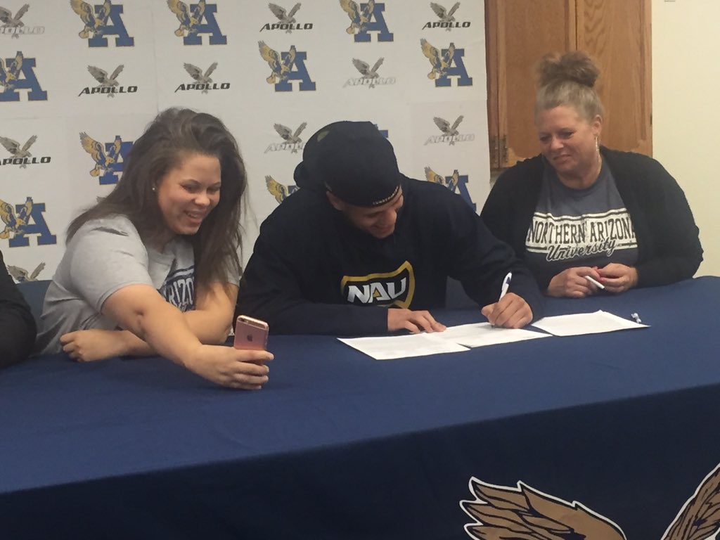 GlendaleUnionAZ's tweet photo. Carson Taylor signing to play football @NAU as dad watches via cell. #ApolloProud #WeAreGUHSD https://t.co/SQikjZX3qd