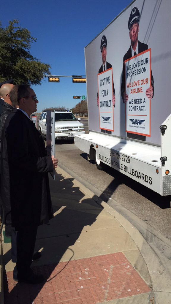 swapapilots's tweet photo. Mobile billboard made a stop in front of #DALpicket. https://t.co/GBgk3ltx9b