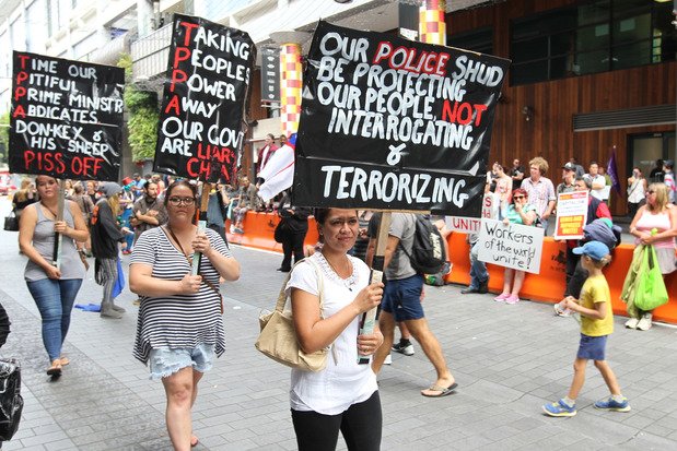 nzherald's tweet photo. TPP protesters are beginning to move again slowly on Hobson St after being stopped by police https://t.co/AXsW6HCV1v https://t.co/wR26H2KkS9