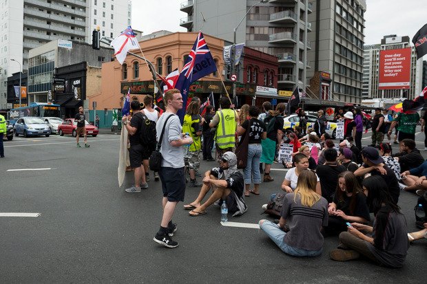nzherald's tweet photo. TPP protesters are beginning to move again slowly on Hobson St after being stopped by police https://t.co/AXsW6HCV1v https://t.co/wR26H2KkS9