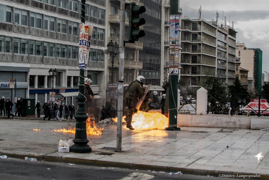 LampDim's tweet photo. #Greece general strike.A molotov cocktail explodes in front of riot police  #Athens #Syntagma #apergia  #4febgr https://t.co/PBiyFpUmwq