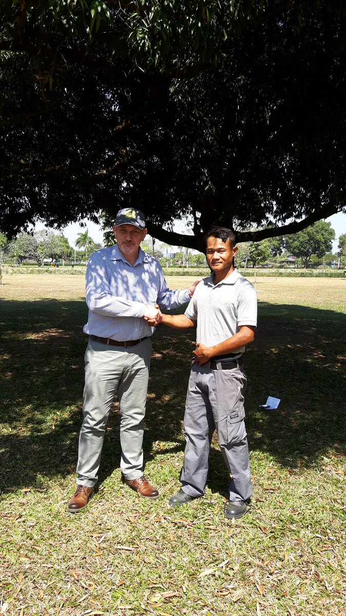SimonHardman's tweet photo. RM Simon Hardman welcomes Khine Kyaw Kyaw to the team in Thanbyuzayat, Myanmar @CWGC https://t.co/yeJ3rnsw3B