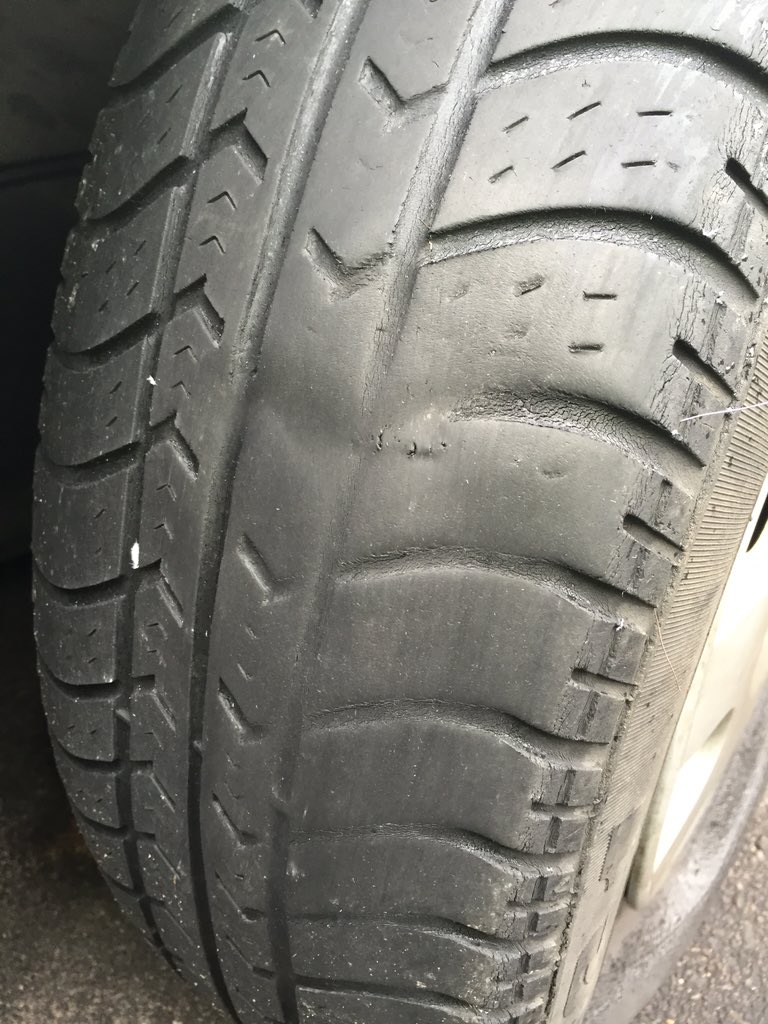 dharford79's tweet photo. This isn't acceptable as a spare. Out of shape, bald &amp; with its wires sticking out. 

Check ALL your tyres. #Tyres https://t.co/PRLkDnpQfJ