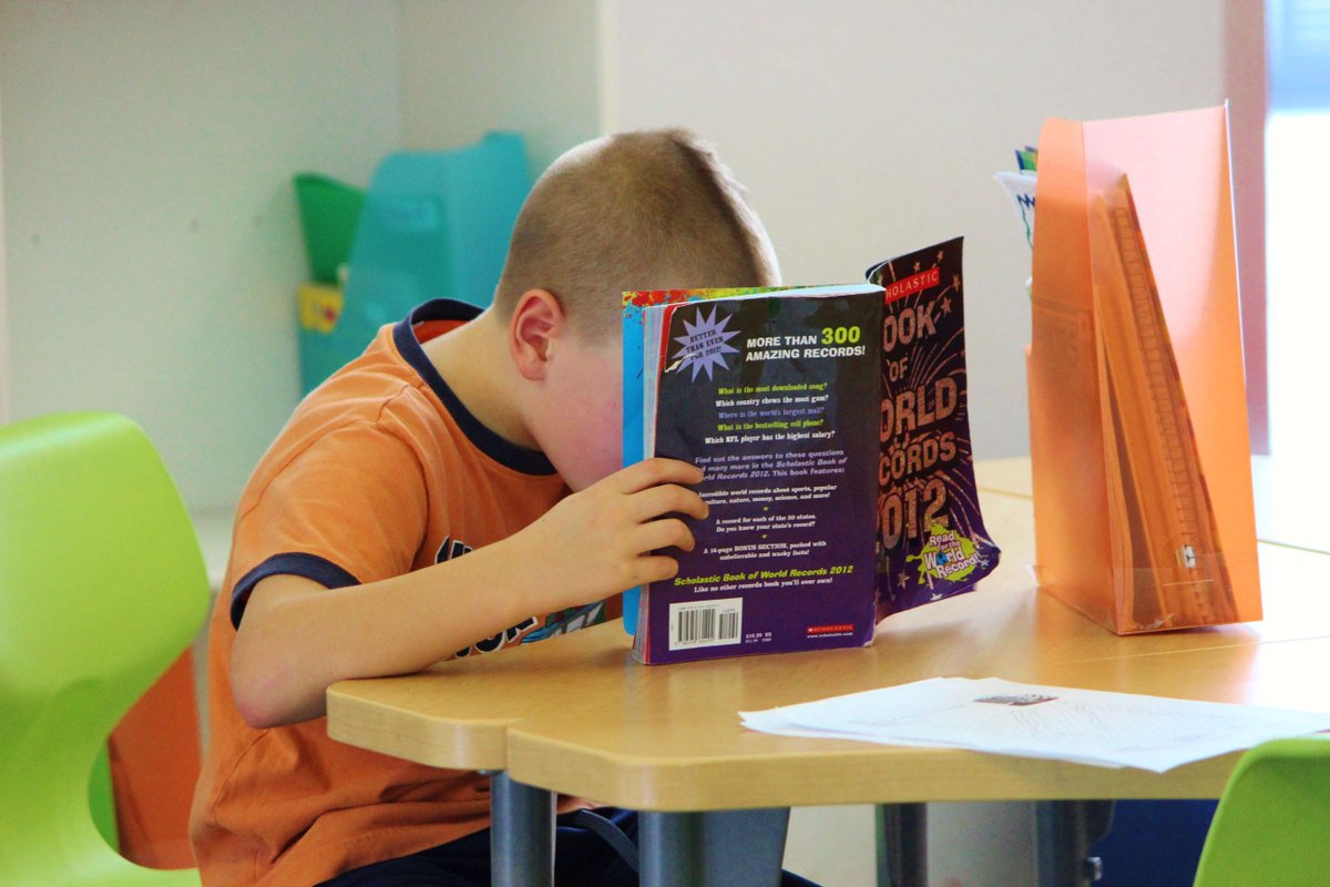 We always love to see our students with their nose (literally) in a book.