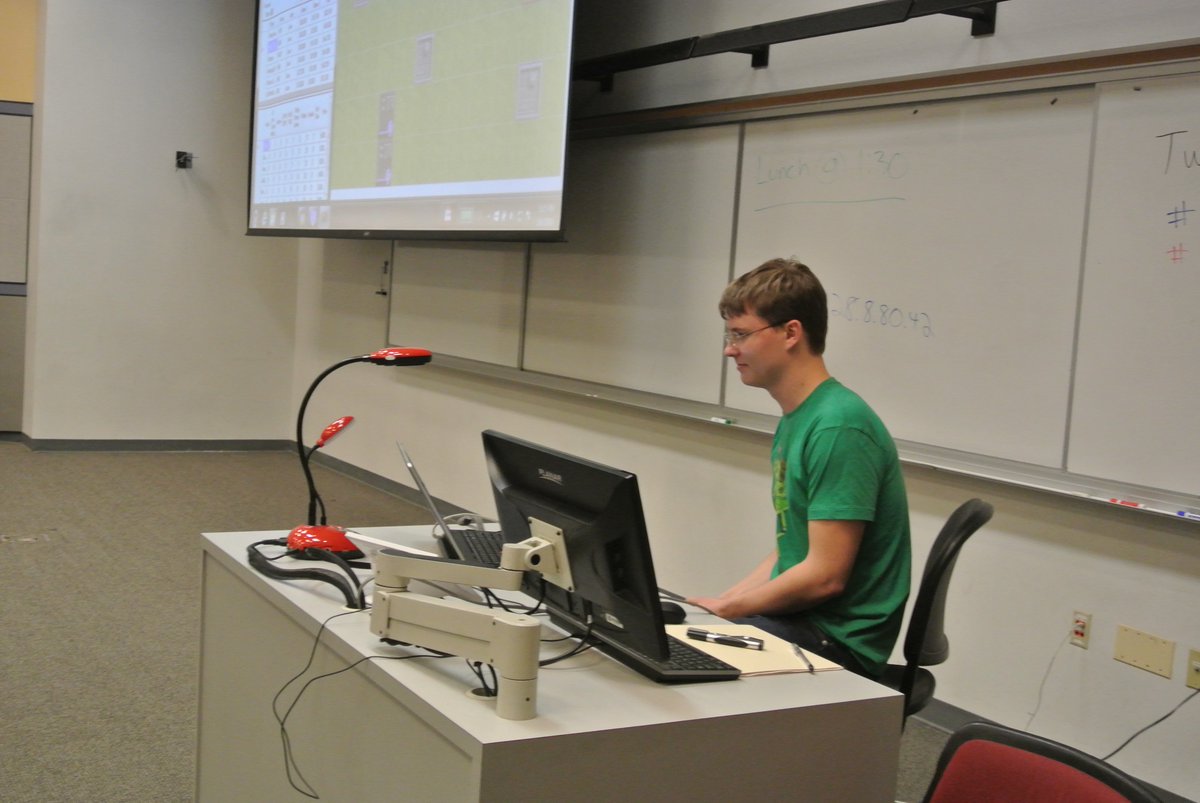 UMDCompSci's tweet photo. Checking out their work before the semi finals... so focused! #WindwardCodeWars #umdcsww https://t.co/K0kbJHK9Z7
