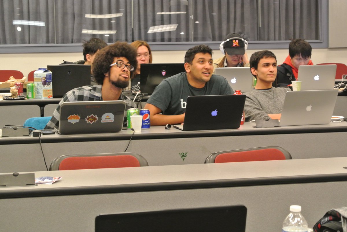 UMDCompSci's tweet photo. Checking out their work before the semi finals... so focused! #WindwardCodeWars #umdcsww https://t.co/K0kbJHK9Z7