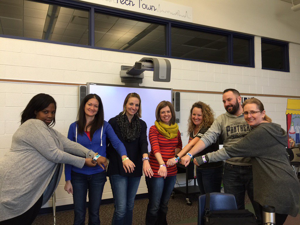 kirs10i's tweet photo. Some D46 teachers & friends showing off their stylish binary bracelets! #codepd @codeorg @ice_il https://t.co/Vl3YSrTTN5