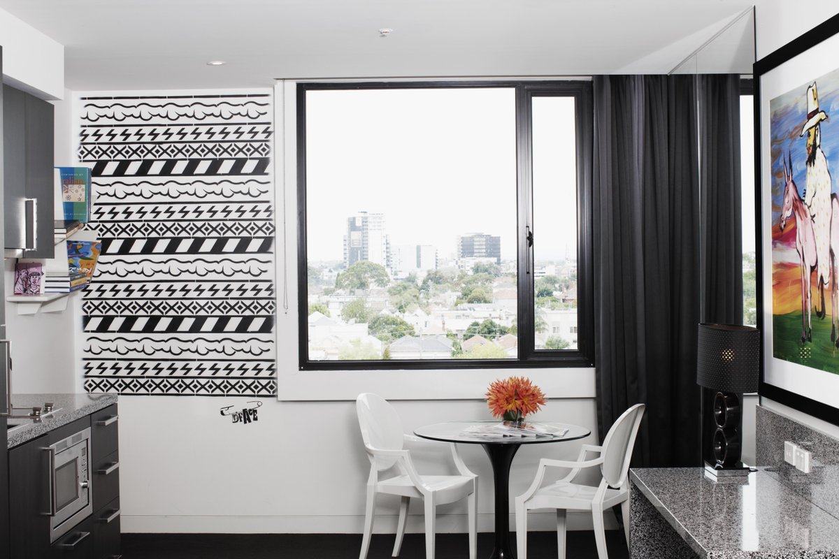 Sleep soundly in D*Face's Art Suite with graphic black and white horizontal stencil art emblazoning the walls.