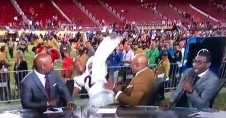 BleacherReport's tweet photo. VIDEO: Aqib Talib wipes out on his way to postgame interview after winning Super Bowl https://t.co/HBB1CUQWi5 https://t.co/g1SpiUSpml
