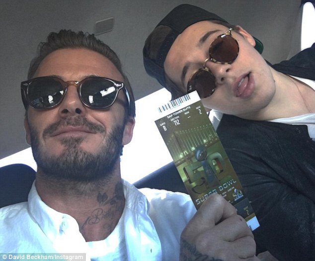 DailyMailCeleb's tweet photo. David Beckham took Brooklyn to his first Super Bowl... awwwww https://t.co/PLPDUW0wA1 https://t.co/VFvJ81ZSjX