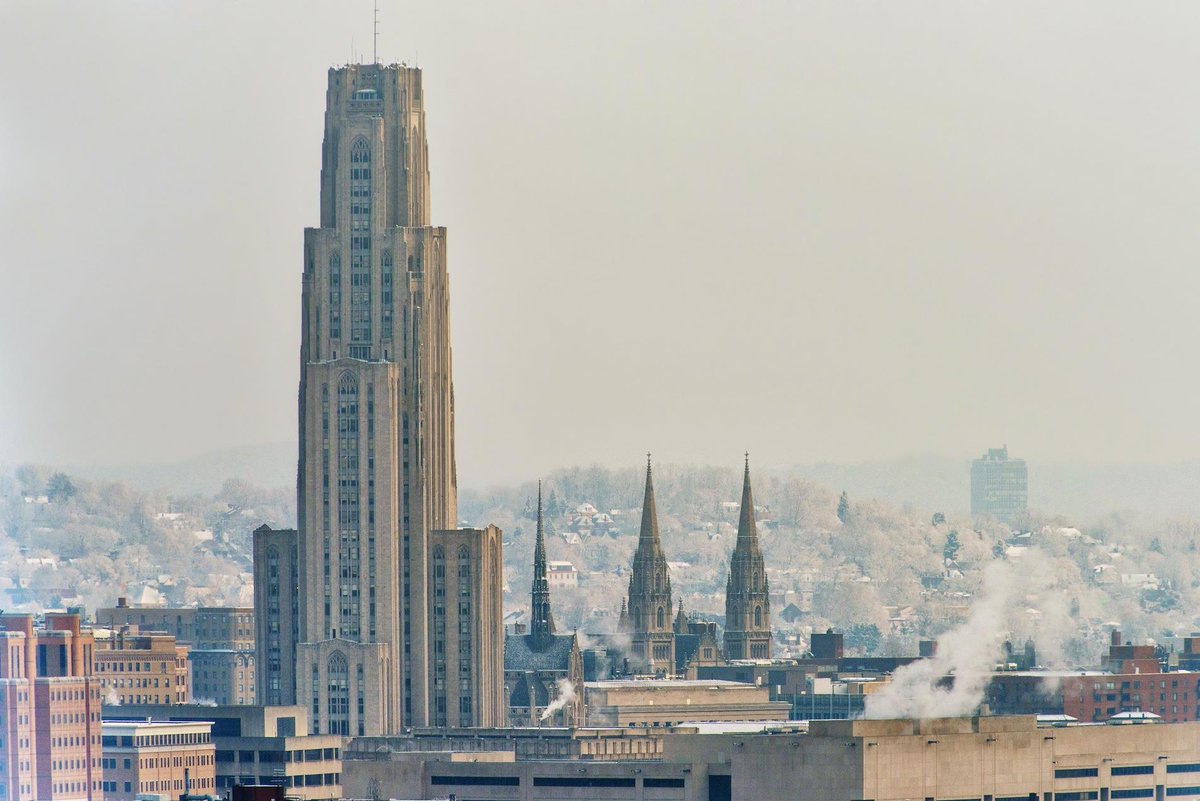 DaveDiCello's tweet photo. Snow falls on the Cathedral of Learning in #Pittsburgh, as the spires of St. Paul's and Heinz Chapel rise behind it. https://t.co/YnVNRryCAl