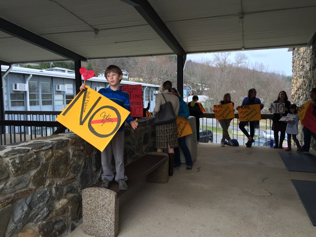 CT_Julie's tweet photo. Students and parents gather outside Asheville schools restructuring meeting.#avlnews https://t.co/zUTi1LMIMo