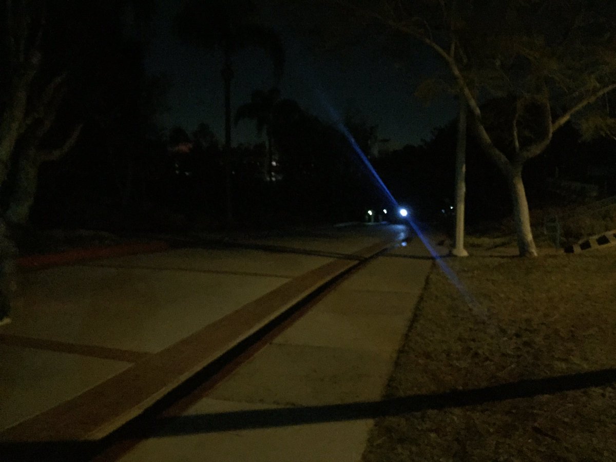 KCRCollegeRadio's tweet photo. Students walking up Hilltop Way between West Commons and Campanile Walkway using phone flashlights to get around. https://t.co/UlLyg3VkAE