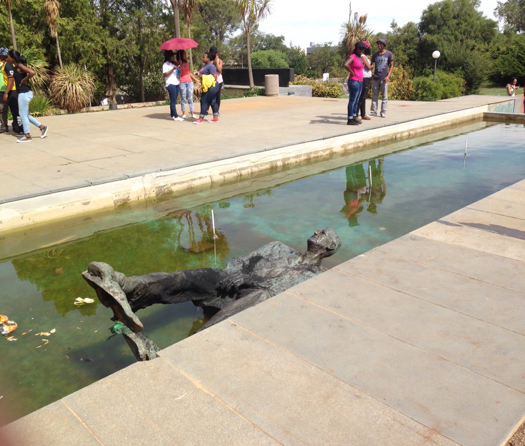 KovsieX's tweet photo. CR Swart left in the fountain #UFSToday #UFSRevolt #UFS https://t.co/E8ipAEN82s