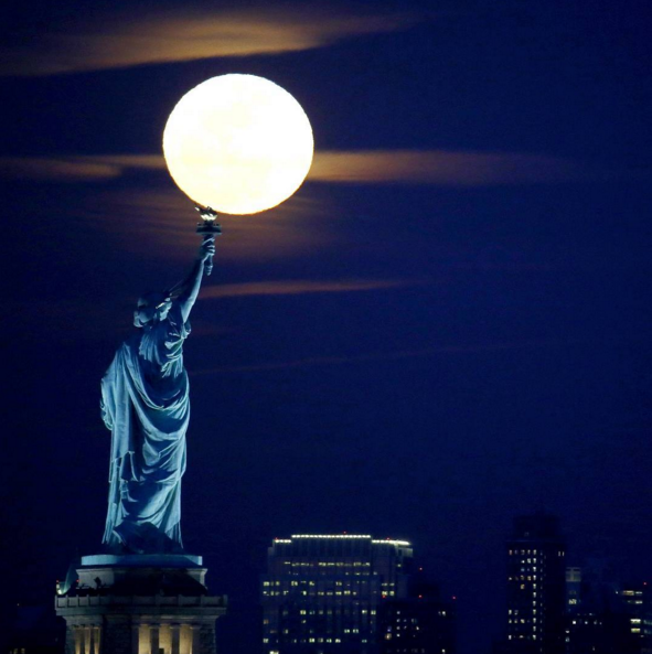 TheEconomist's tweet photo. From Instagram: A full moon over the Statue of Liberty seen from Jersey City, NJ, Feb. 22nd https://t.co/M9br4nYP7i https://t.co/uCpqPDNi7C