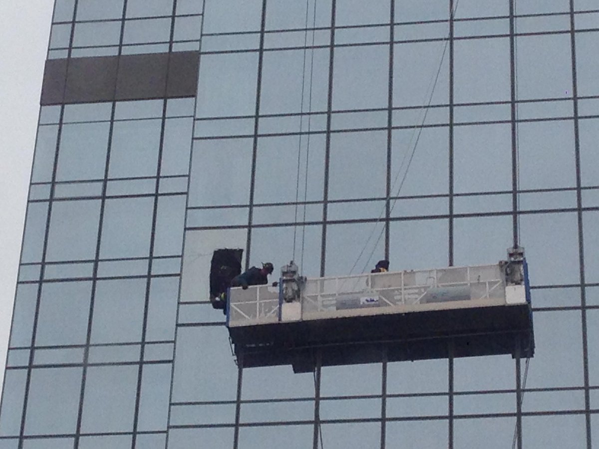 #FDNY Rescue 1 has breached the glass and is making contact with the workers.