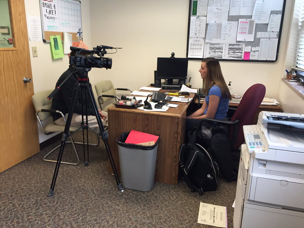 RegisCatholic's tweet image. Neil from @WEAU13News at #RegisHS talking to Ms. Pagel about a new scholarship from @UWEauClaire for local students.