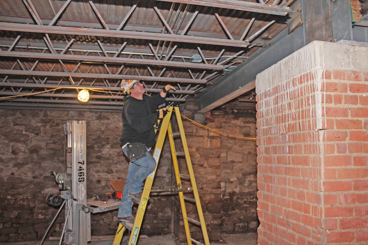A <a href="/IBEW/">IBEW</a> 58 electrician installs conduit through a new truss for the #Detroit Lear/119 State Street project