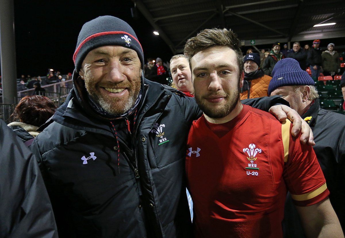 Wales coach Robin McBryde celebrates with his son after his last minute