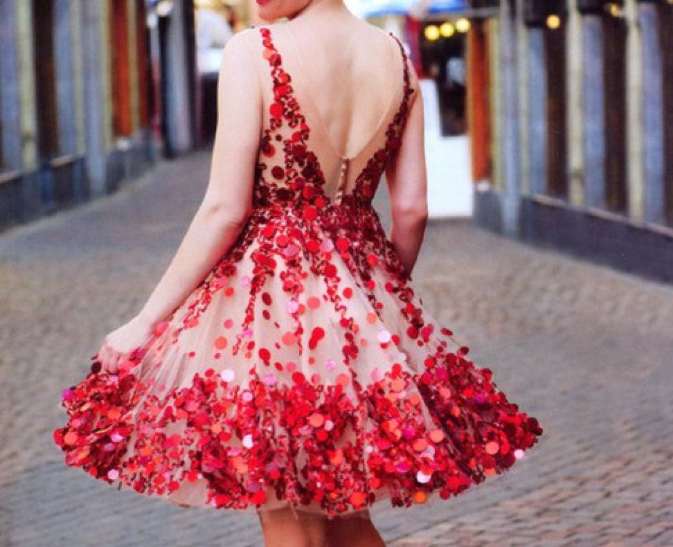 *She slips on her beautiful one of a kind dress and heads to the gym to get the #SweetheartDance set up*