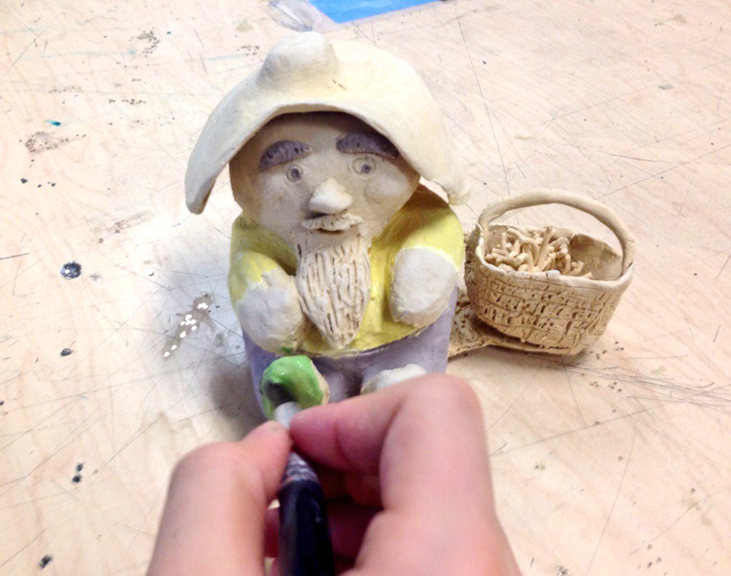 Sixth graders are glazing their gnomes