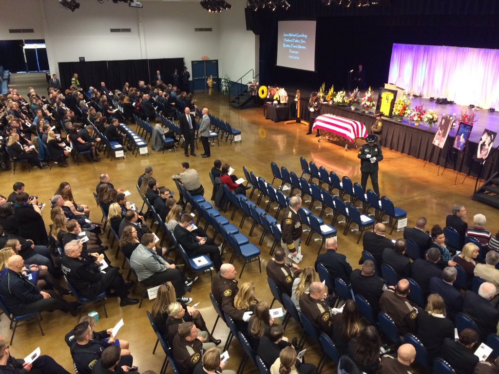 Maggie_Vespa's tweet image. Just seated in Seaside Convention Center. Huge crowd. Officers passing out programs &amp;amp; wristbands for Sgt. #Goodding