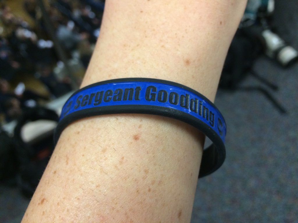 Maggie_Vespa's tweet image. Just seated in Seaside Convention Center. Huge crowd. Officers passing out programs &amp;amp; wristbands for Sgt. #Goodding