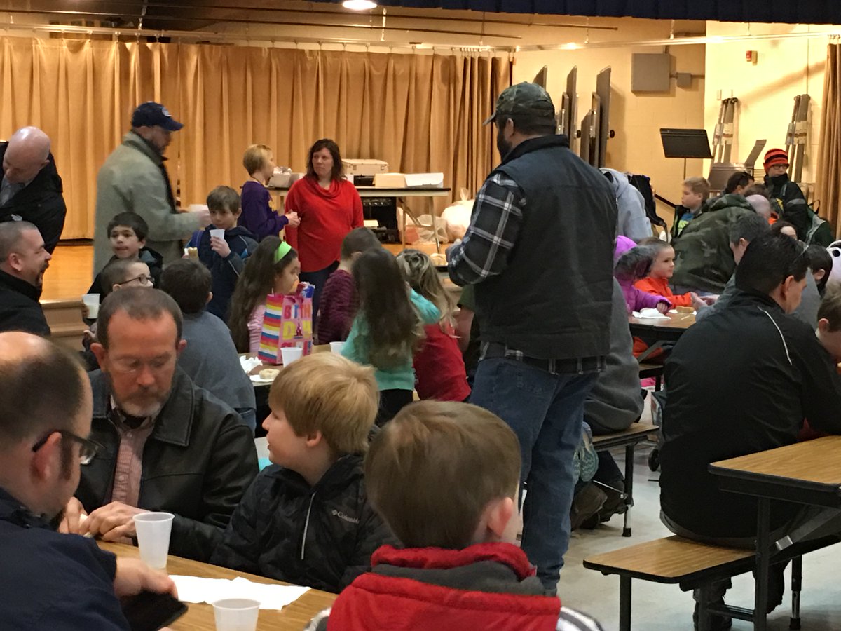 OFEWCPS's tweet photo. OFE students enjoying donuts with Dad. #thanksPTA https://t.co/zqR1l1VN5C