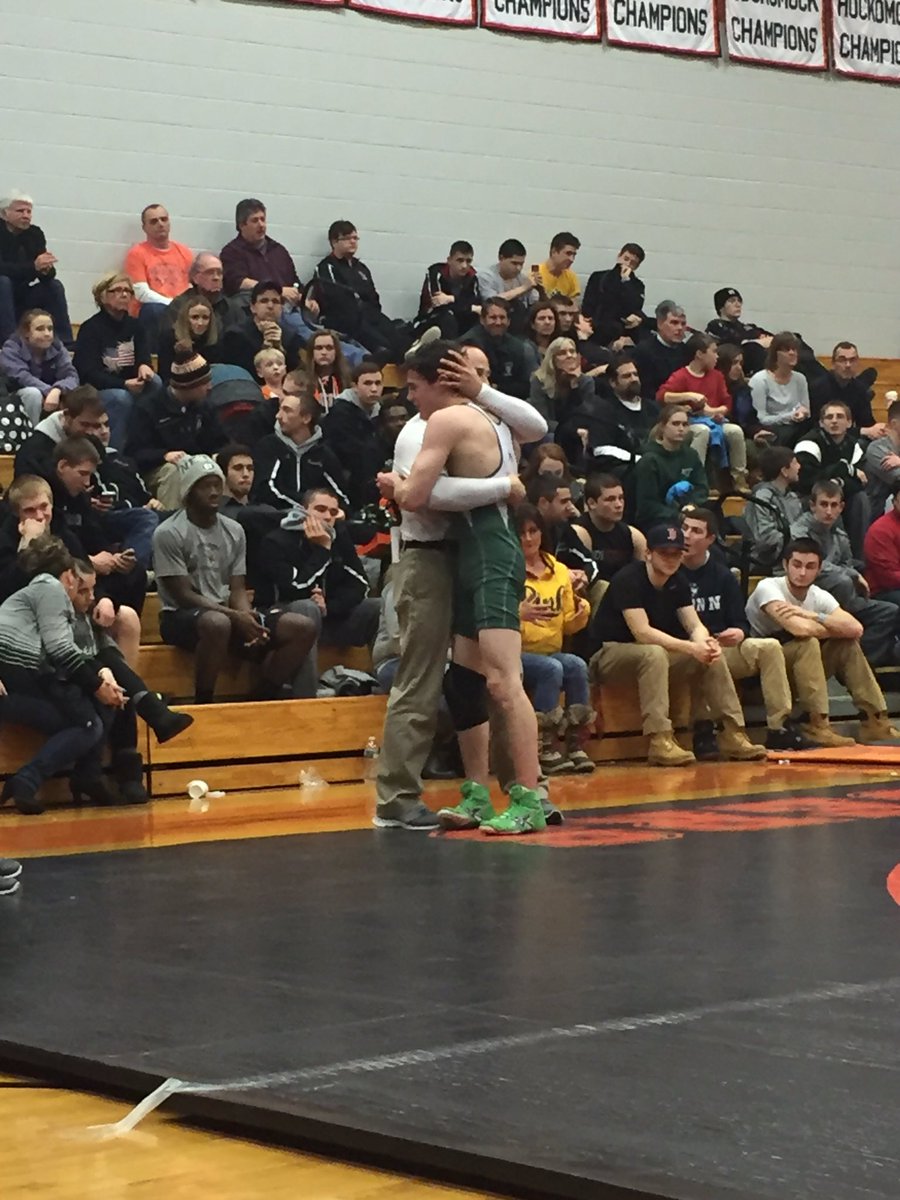 TheRealACarr's tweet photo. @DuxburyWrestle coach Kyle McCarthy embraces Carter Lewis after Lewis wins the 120-lbs D2 south sectional title https://t.co/FLfjL309VG