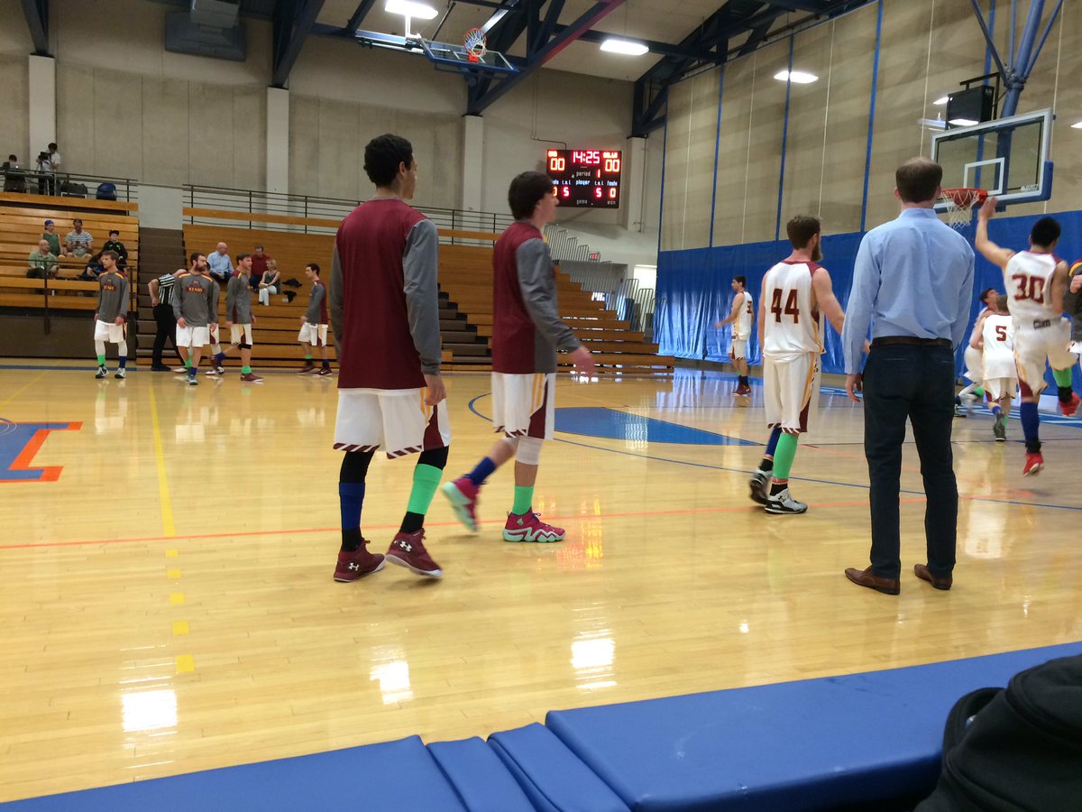 Stag Basketball raising eating disorder awareness in their green and blue game socks against Cal Lu Kingsmen.